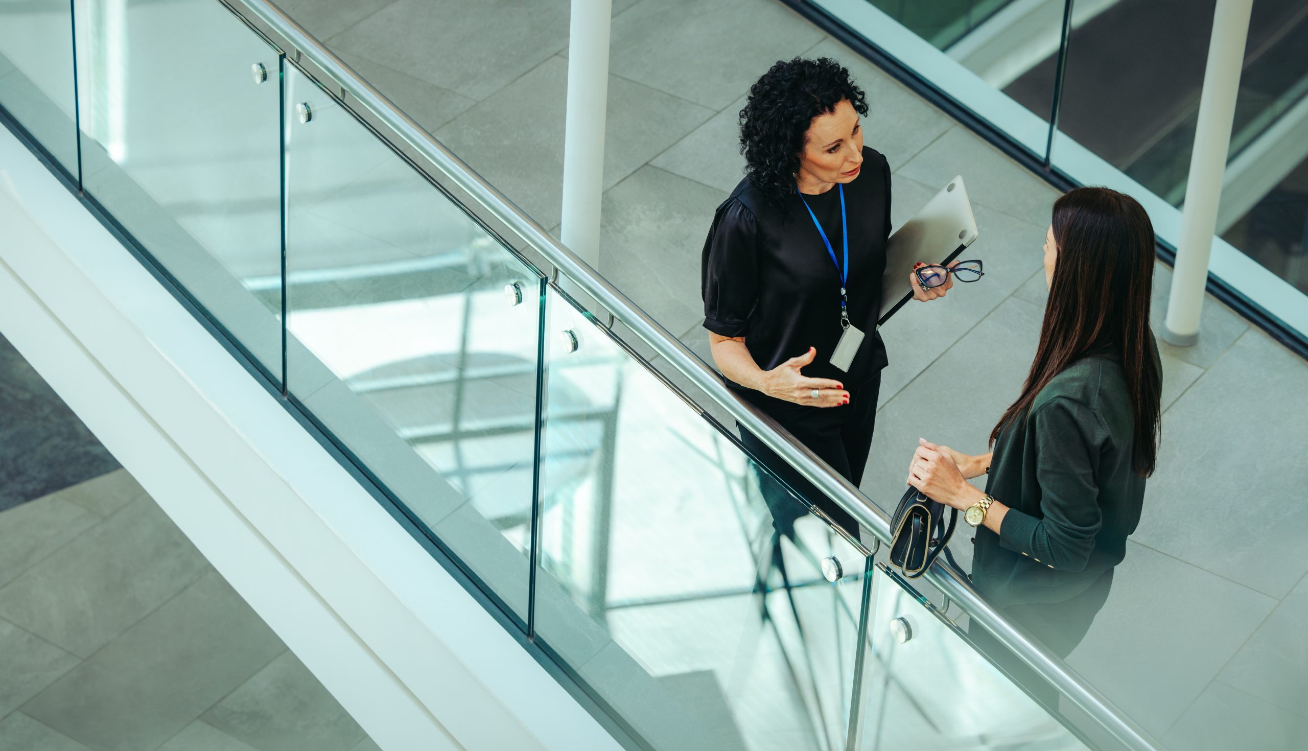 A,High-angle,View,Showcases,Two,Colleagues,Engaging,In,Discussion,In